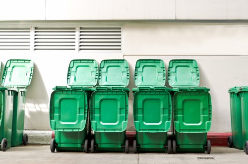 Crew securing load on a waste collection vehicle